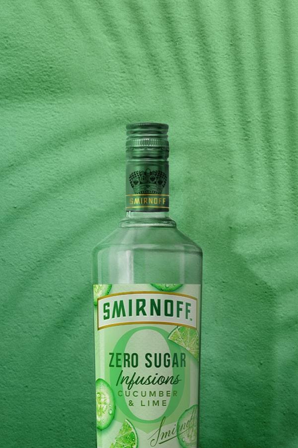 Smirnoff Zero Sugar Infusions Cucumber & Lime on green tropical background