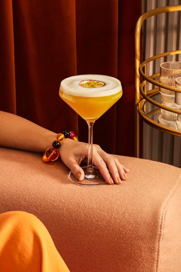 Passionfruit Martini cocktail on couch