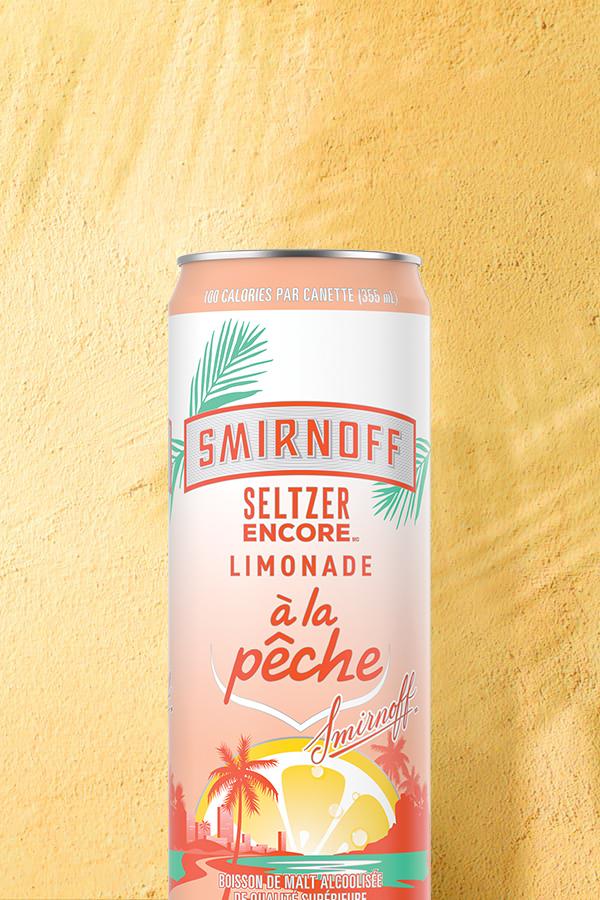 Smirnoff Seltzer Peach Lemonade on a tropical background