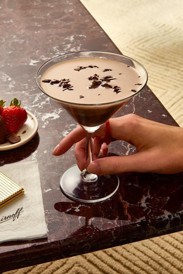 Smirnoff Chocolate Martini on a granite table with strawberries
