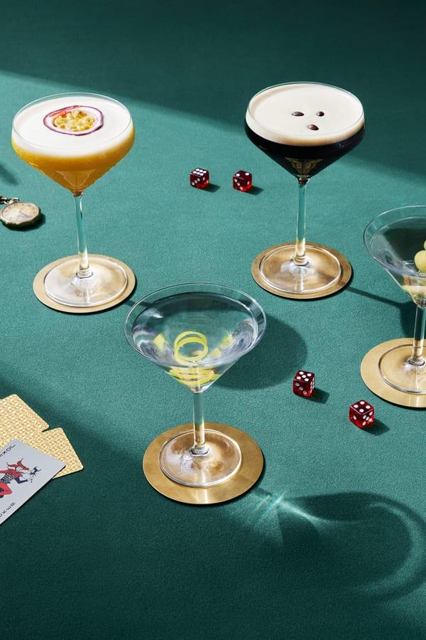 Martini cocktails on a table with dice