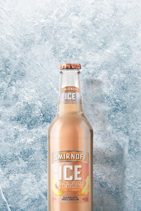 Smirnoff Ice Peach Bellini on a Icy background