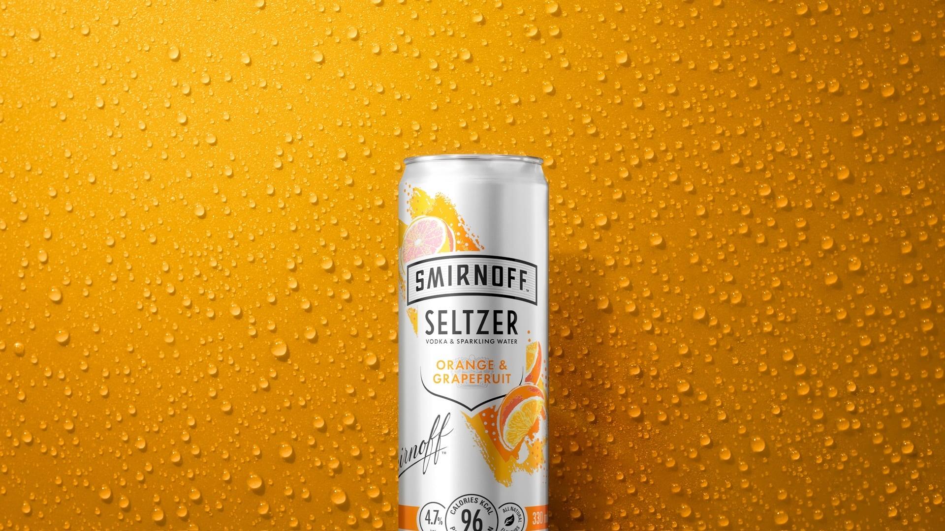 Orange Grapefruit Seltzer on a textured orange background