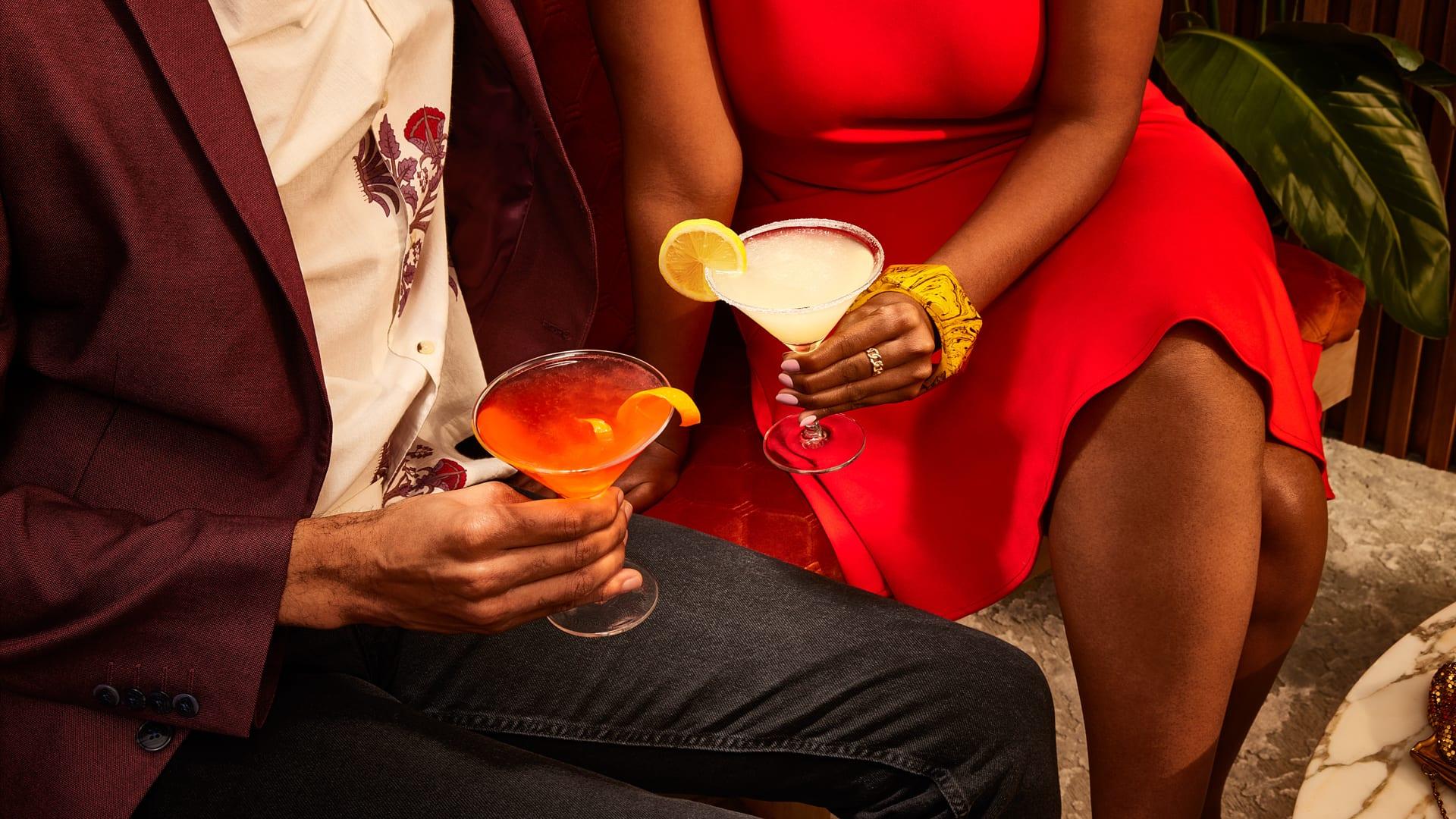 Two people enjoying two Smirnoff cocktails