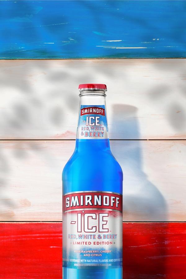 Smirnoff Red, White & Berry Ice on a wood background