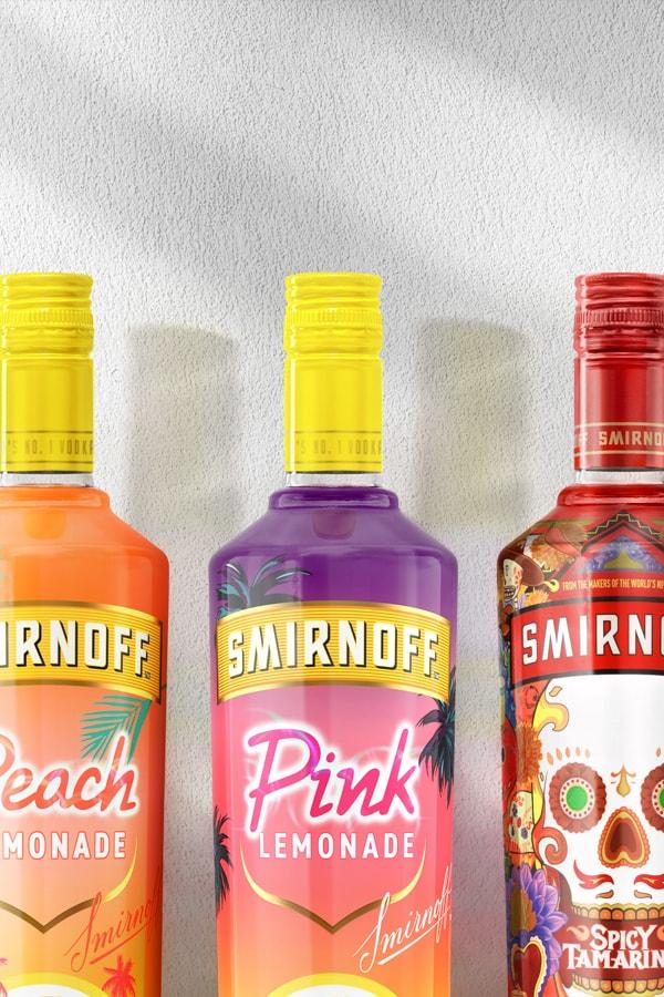 Smirnoff RWB, Peach, Pink, Spicy Tamarind, and Peppermint Twist Vodkas on a plain background